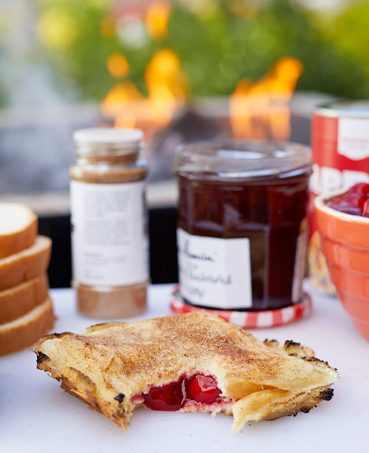 Campfire pies with ingredients and a campfire in the background